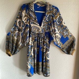 Stunning Free People dress. The detail on the back makes this so unique!